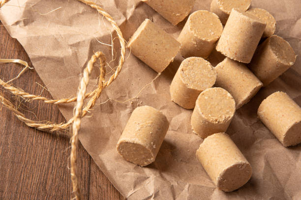 istock Peanut candy (paçoca or pacoca) Traditional Brazilian peanut-based candy, arranged on brown paper on a table. Selective Focus. 1335083337