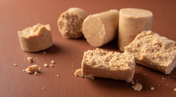 istock Peanut candy (paçoca or pacoca) Traditional Brazilian peanut-based candy on a leather surface. Selective Focus. 1335083429