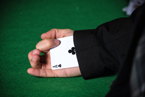 Man with ace up his sleeve stock photo