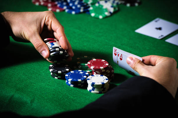 istock Man in casino with ace and king 1335083644