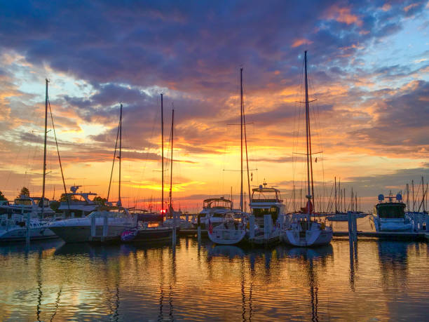 Monroe Harbor Sun rising over sailboats in the harbor moored stock pictures, royalty-free photos & images