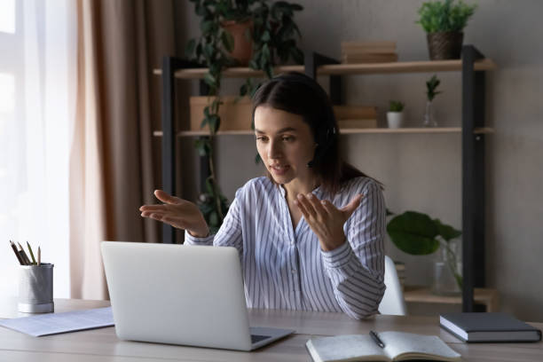 istock Caucasian woman worker have online webcam call on computer 1335085215