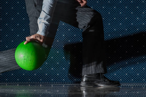 istock Person throwing a green bowling ball.. 1335086129