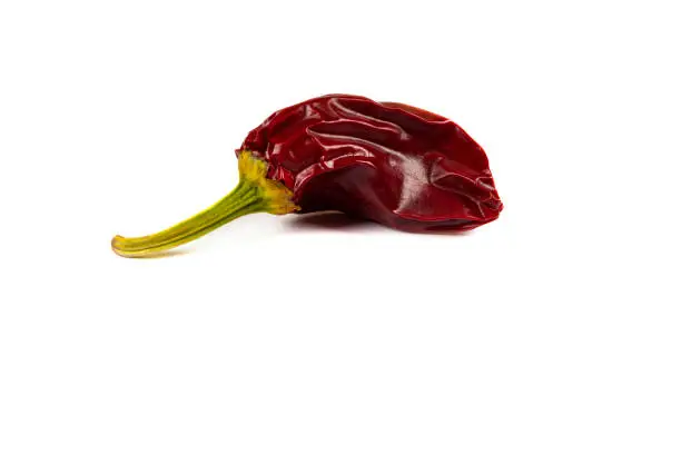 Espelette pepper on a white background.