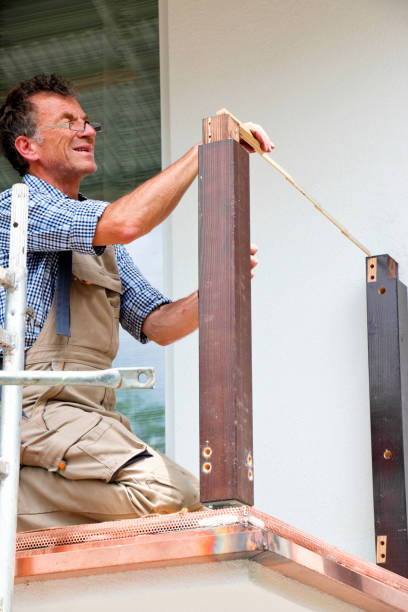 istock Carpenter measuring the distance of two posts 1335097497