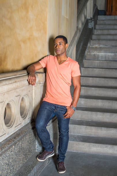 istock Portrait of Young Black College Student standing inside office building, looking forward 1335097880