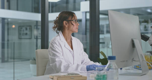 istock Shot of a mature scientist working on a computer in a lab 1335097978