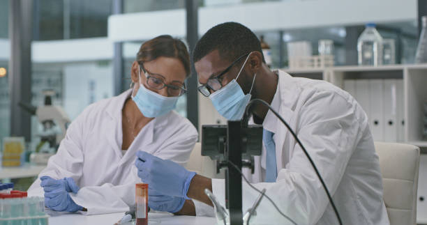 istock Shot of two scientists analysing samples in a lab 1335098244