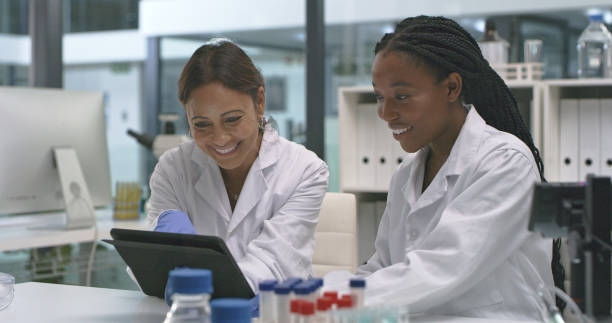 istock Shot of two scientists using a digital tablet in a lab 1335098247