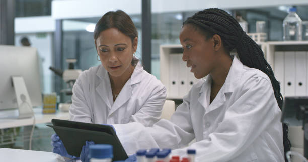 istock Shot of two scientists using a digital tablet in a lab 1335098248