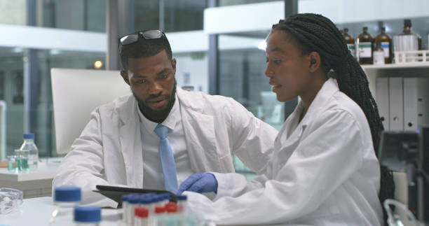 istock Shot of two scientists using a digital tablet in a lab 1335098252