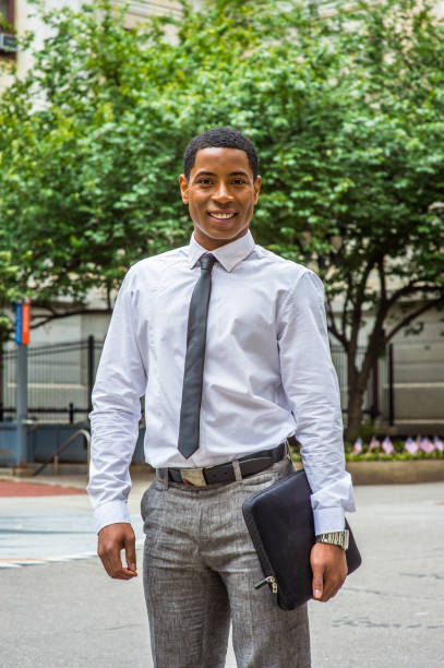 istock Portrait of Young black businessman standing outdoors, looking forward 1335098849