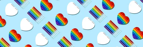 Photo of Rainbow markers pop-it, notepad seamless pattern banner.