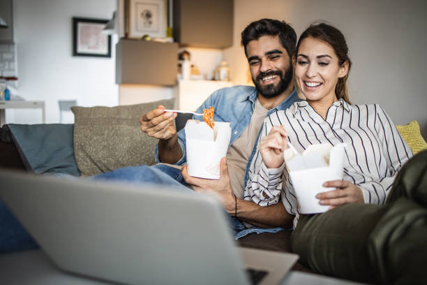 istock Couple at home having a movie night 1335109544