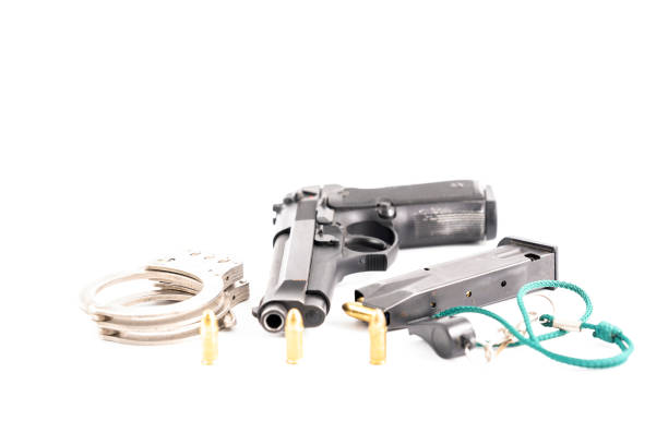 istock Pistol, charger and handcuffs. 1335109611
