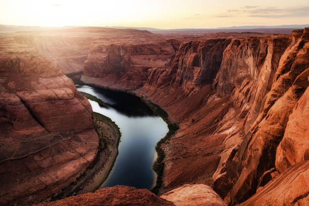 Low Water Level on Colorado River Drought conditions causing low levels in the Colorado River which supplies water to western USA and Mexico. horseshoe bend river stock pictures, royalty-free photos & images