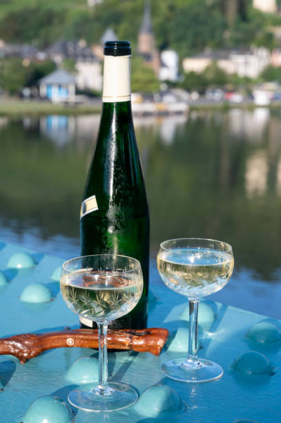 istock White quality riesling wine served on old bridge across Mosel river with view on old German town in sunny day 1335110666
