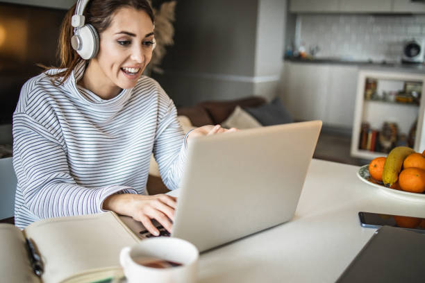 istock Woman at home, using laptop 1335111790