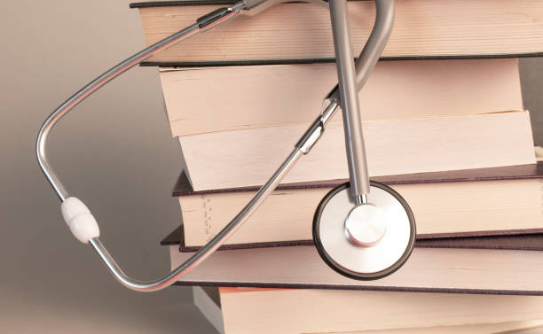 Concept of medical education with book and stethoscope stock photo