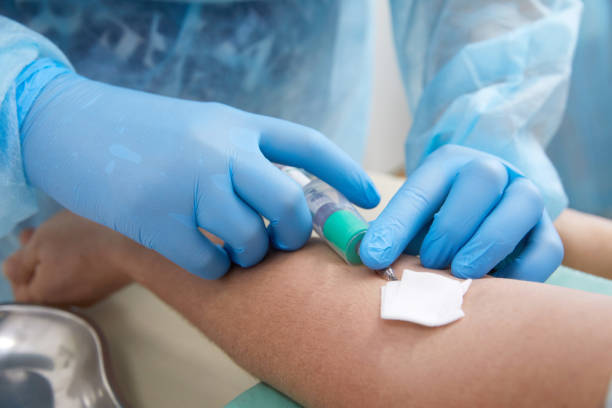 istock Nurse taking blood sample to make a test in laboratory 1335111894