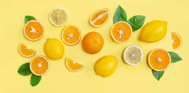 istock Composition of citrus lemons and oranges on a yellow background 1335111938