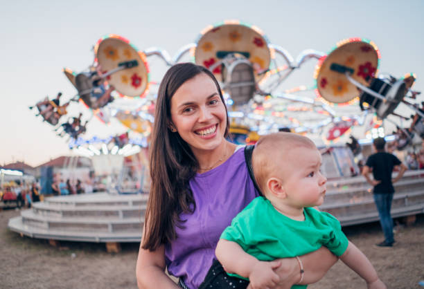 istock Happy Boy and Mother on Carousel 1335112004
