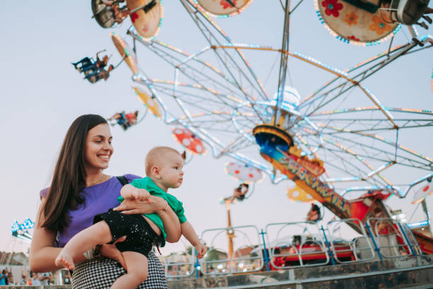 istock Family in the amusement park 1335112665