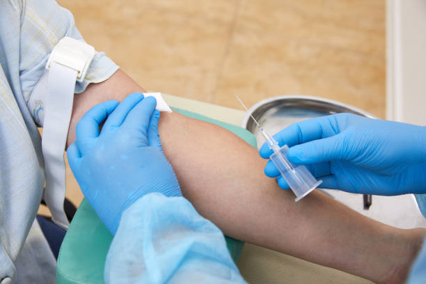 istock Nurse taking blood sample to make a test in laboratory 1335112666