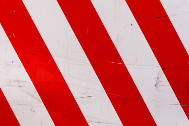istock red and white diagonal stipes on flat steel sheet - caution road sign 1335114479