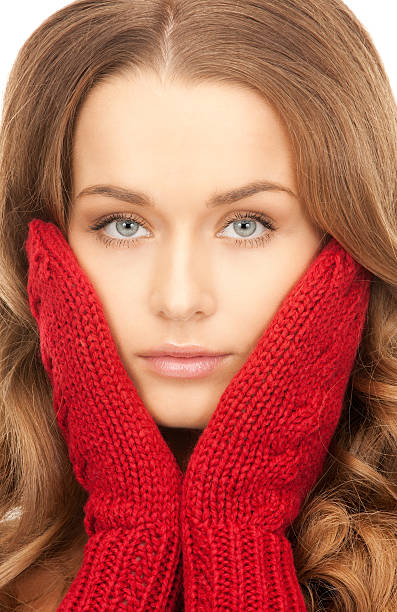 istock beautiful woman in red mittens 133511563