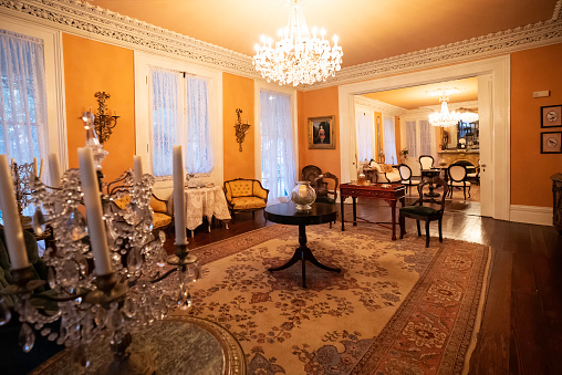 Empty apartment with classical fireplace in perspective and before renovation