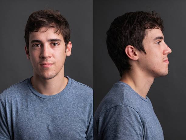 serious young man front and profile mugshots - achterdocht fotos stockfoto's en -beelden