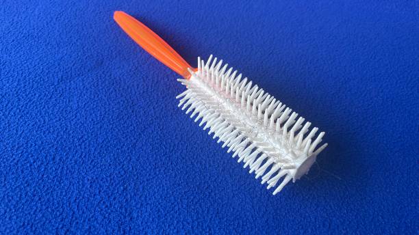 istock a circular comb that has been used on a blue background 1335122770