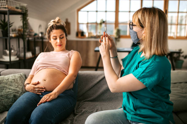 istock Pregnant woman getting vaccinated 1335127788