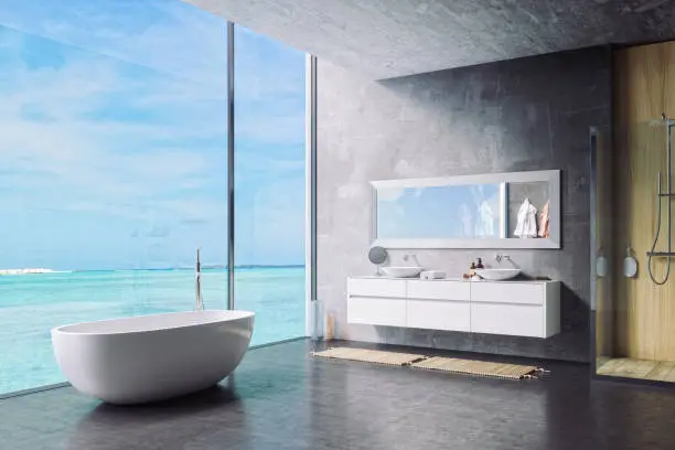 Interior of a minimalist luxury bathroom with beautiful tropical ocean view.