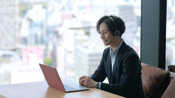 istock asian businessman using computer online meeting 1335142557