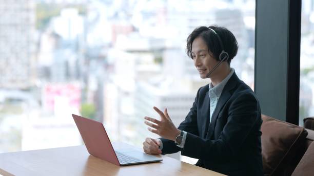 istock asian businessman using computer online meeting 1335142559
