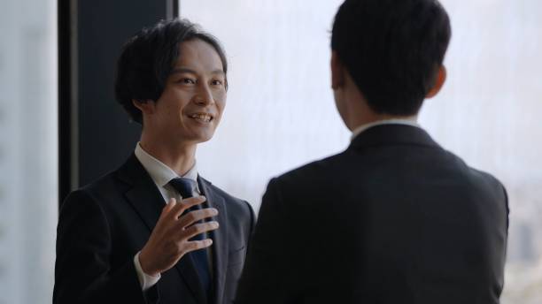 istock asian businessmen talking in the office 1335142607