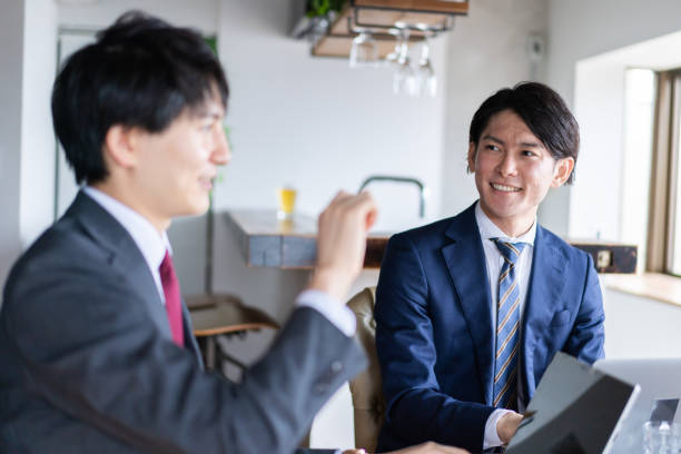 istock Two businessmen having a meeting 1335159872