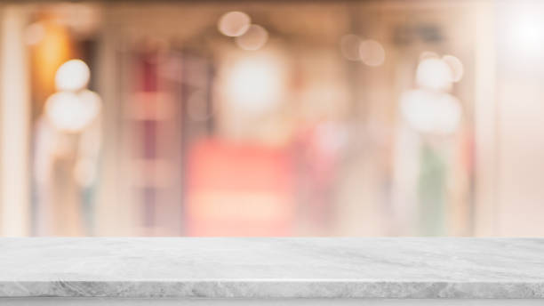 istock Empty white marble stone table top and blur glass window interior cafe and restaurant banner mock up abstract background - can used for display or montage your products. 1335161440