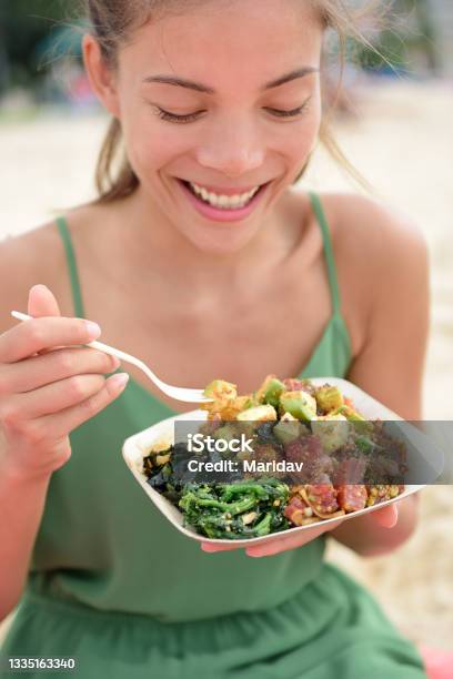 Woman Eating Local Hawaii Food Poke Bowl Salad Stock Photo - Download Image Now - Eating, Poke - Food, People