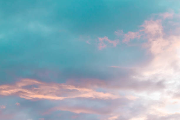 istock Sunset in Russia in spring. Beautiful light pink clouds on a blue sky. Background. Copy space 1335166913