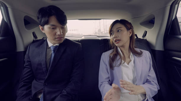 istock Business couple having discussion in car 1335167206