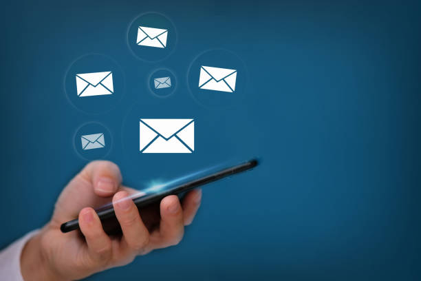 istock Businessman working on computer virtual screening, email marketing concept, person reading e-mail on smartphone, receive new message 1335170101