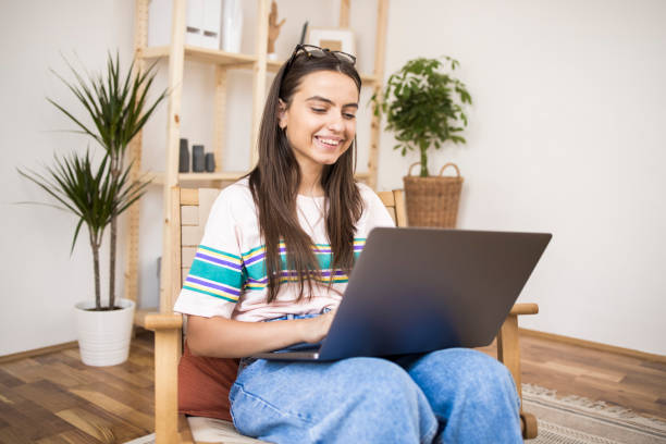istock Girl enjoying at home and using a laptop 1335174008