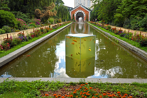 Pond with fish and fountain in Moscow State University's Botanic Garden (Apothecary Garden)