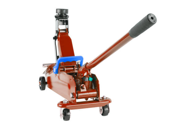 istock red hydraulic car jack isolated on white background, rised up 1335179876