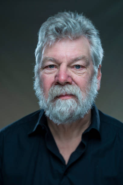 istock portrait real man with beard, looking straight in camera 1335182216