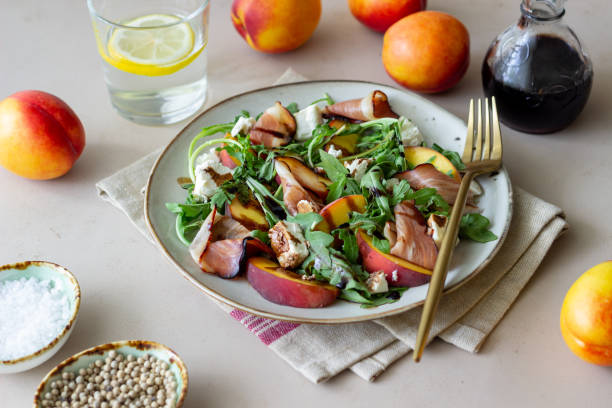 istock Salad with peaches, arugula, cheese and jamon. Healthy eating. 1335183017