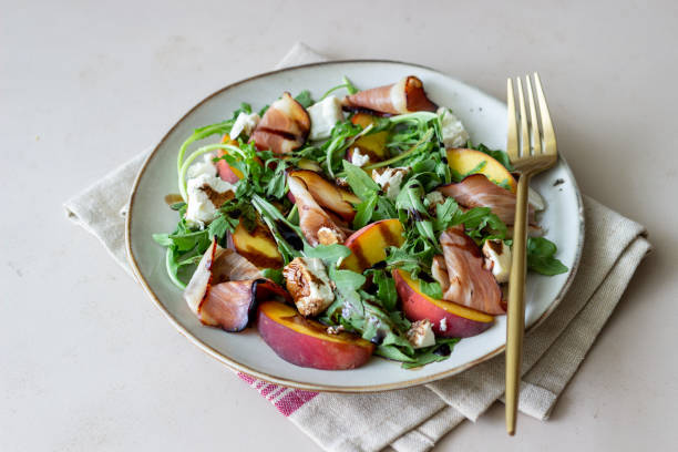 istock Salad with peaches, arugula, cheese and jamon. Healthy eating. 1335183058